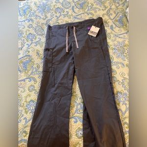 Gray medium tall scrub bottoms. New with tags. Never worn.
